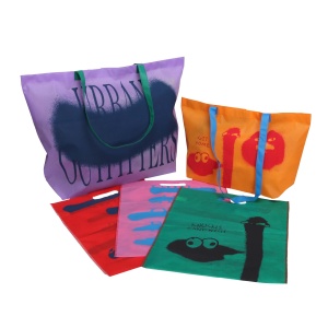 A collection of colorful tote bags featuring abstract designs and prints, highlighting our design services. The bags are in purple, orange, red, pink, and green hues with unique graphic patterns and text. They have sturdy handles, ideal for shopping or casual use.