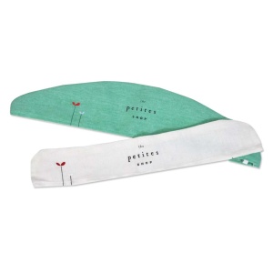 Two fabric headbands, one green and one white, are charming accessories that feature a minimalist red flower design and the text "les petites" printed in the center.