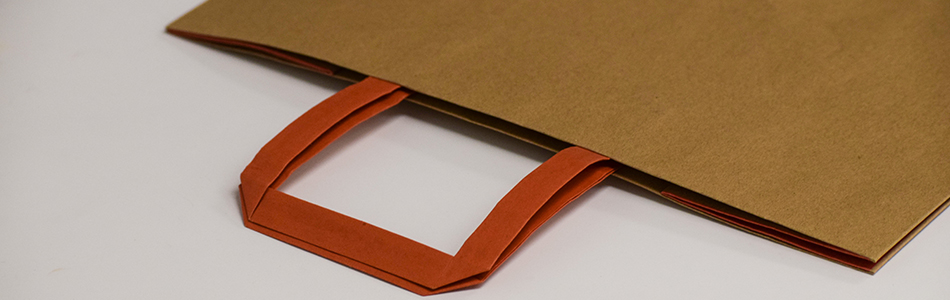 You are currently viewing How We Add Handles To Paper Shopping Bags
