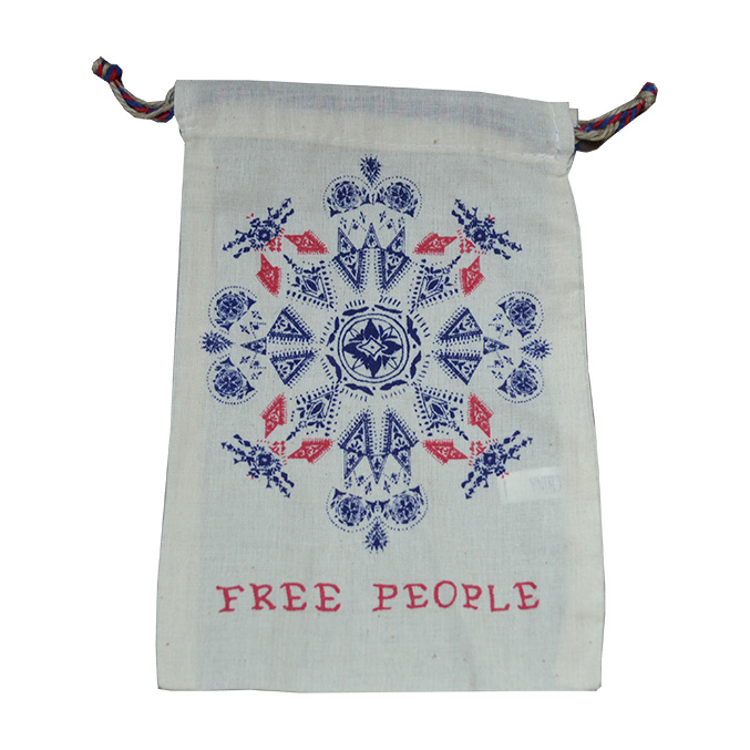 A drawstring bag featuring a symmetrical, mandala-style design in blue and red on a white background. The words Free People are printed in red at the bottom. The drawstrings are multicolored.