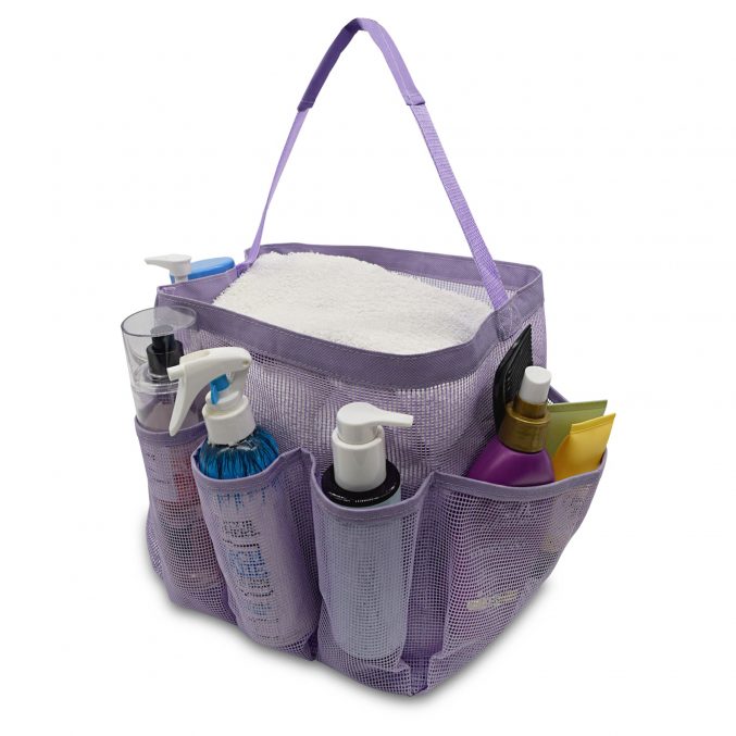 A purple mesh shower caddy with a handle, containing a white towel, bottles of shampoo, conditioner, and body wash, and several toiletries in its outer pockets.