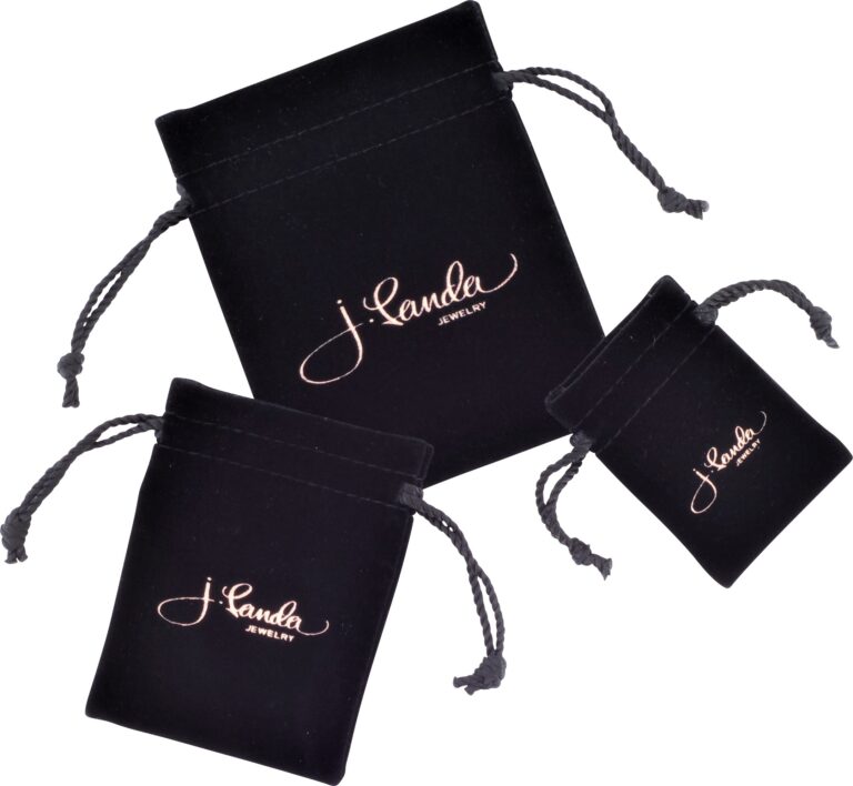 Three black drawstring pouches of varying sizes, featuring J. Landa Jewelry in elegant script, exemplify luxury jewelry packaging. The bags rest on a white background, showcasing their texture and openings with sophisticated charm.