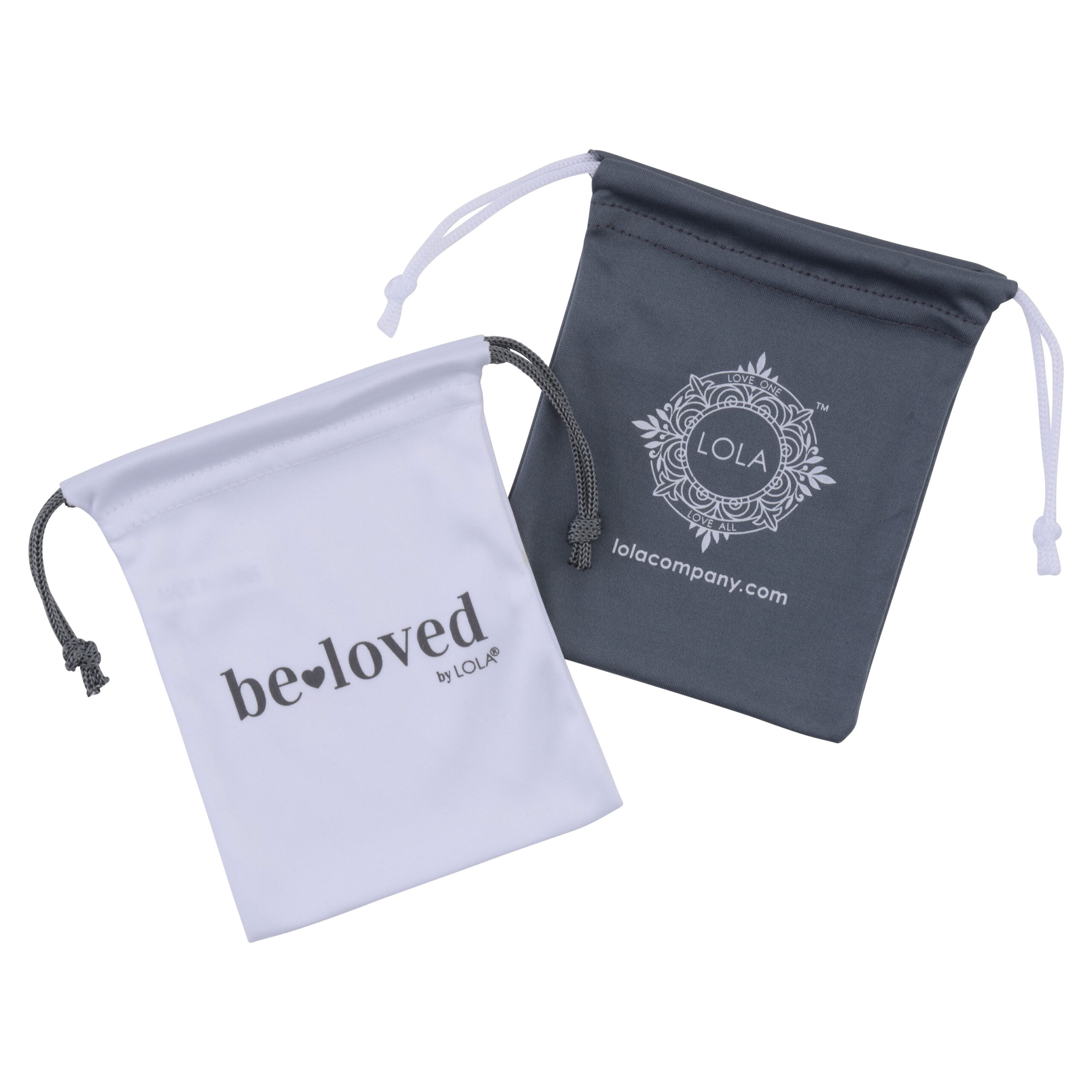 Two drawstring pouches are shown. The white pouch has the text be-loved by LOLA®, and the gray pouch features a decorative design with LOLA and lolacompany.com™ printed on it.