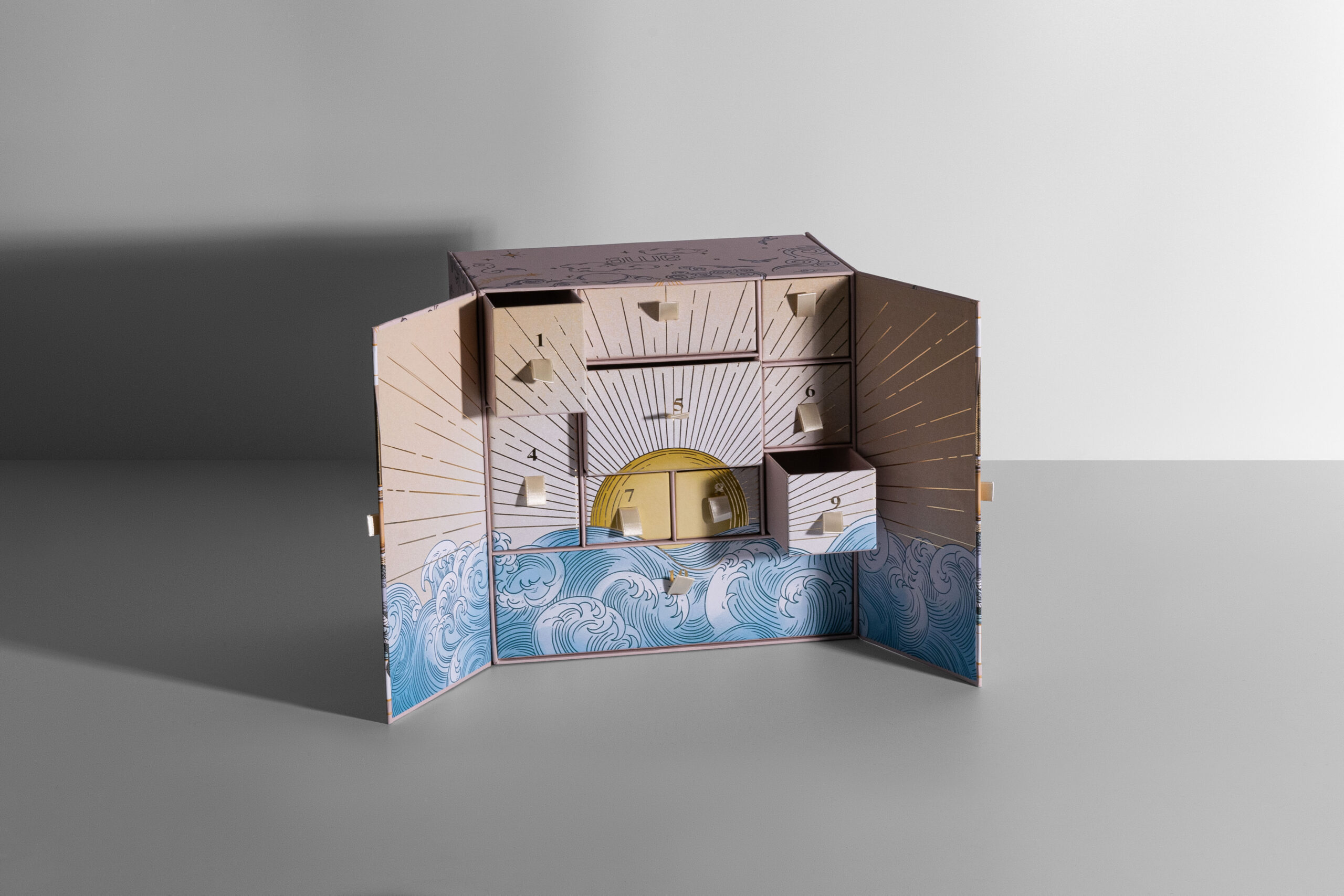Awe Inspired Jewelry advent calendar box, luxury rigid holiday packaging for memorable unboxing experiences
