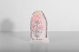 Free People custom totes and muslin pouches with vintage-inspired design