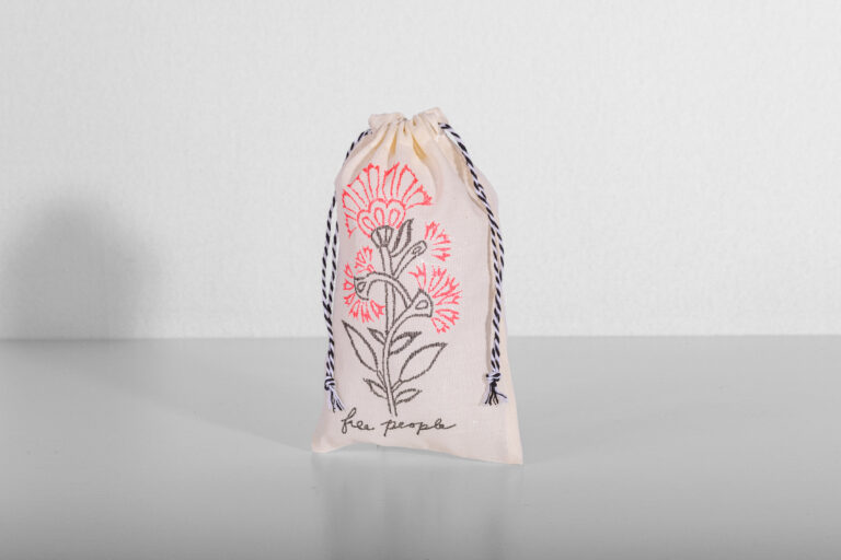 Free People custom totes and muslin pouches with vintage-inspired design
